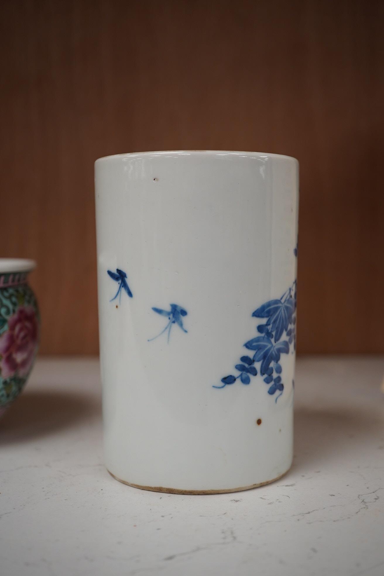 A Chinese blue and white brush pot and famille rose miniature jardiniere, tallest 12cm. Condition - good